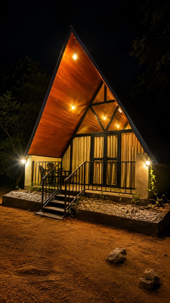 Green Heaven A-frame cabana glowing at night